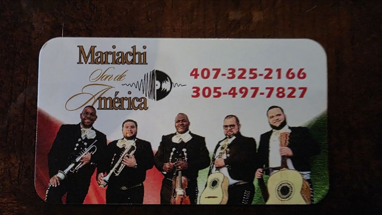 Mariachi Son de América card showing five musicians and contact numbers 407-325-2166 and 305-497-7827.